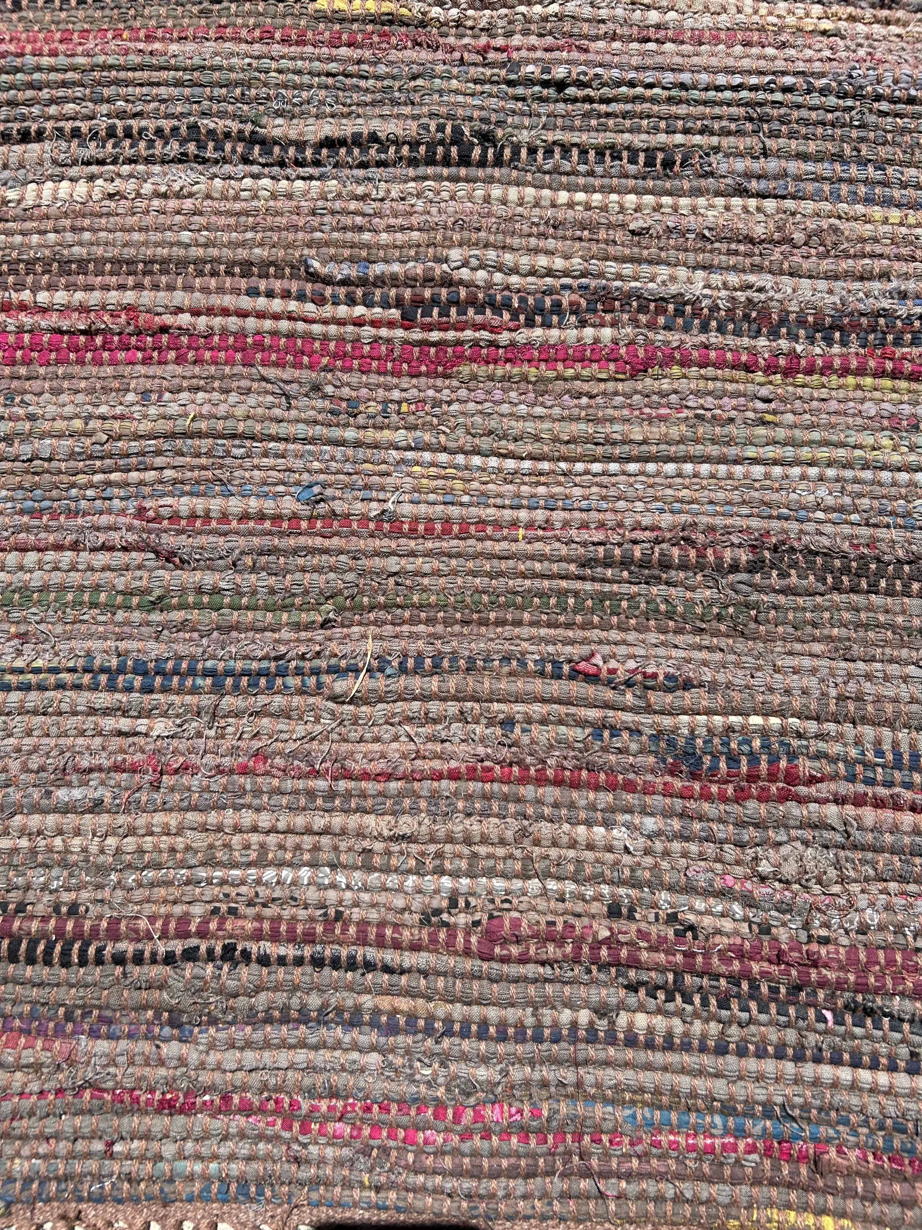 Textured rug with multicolored stripes