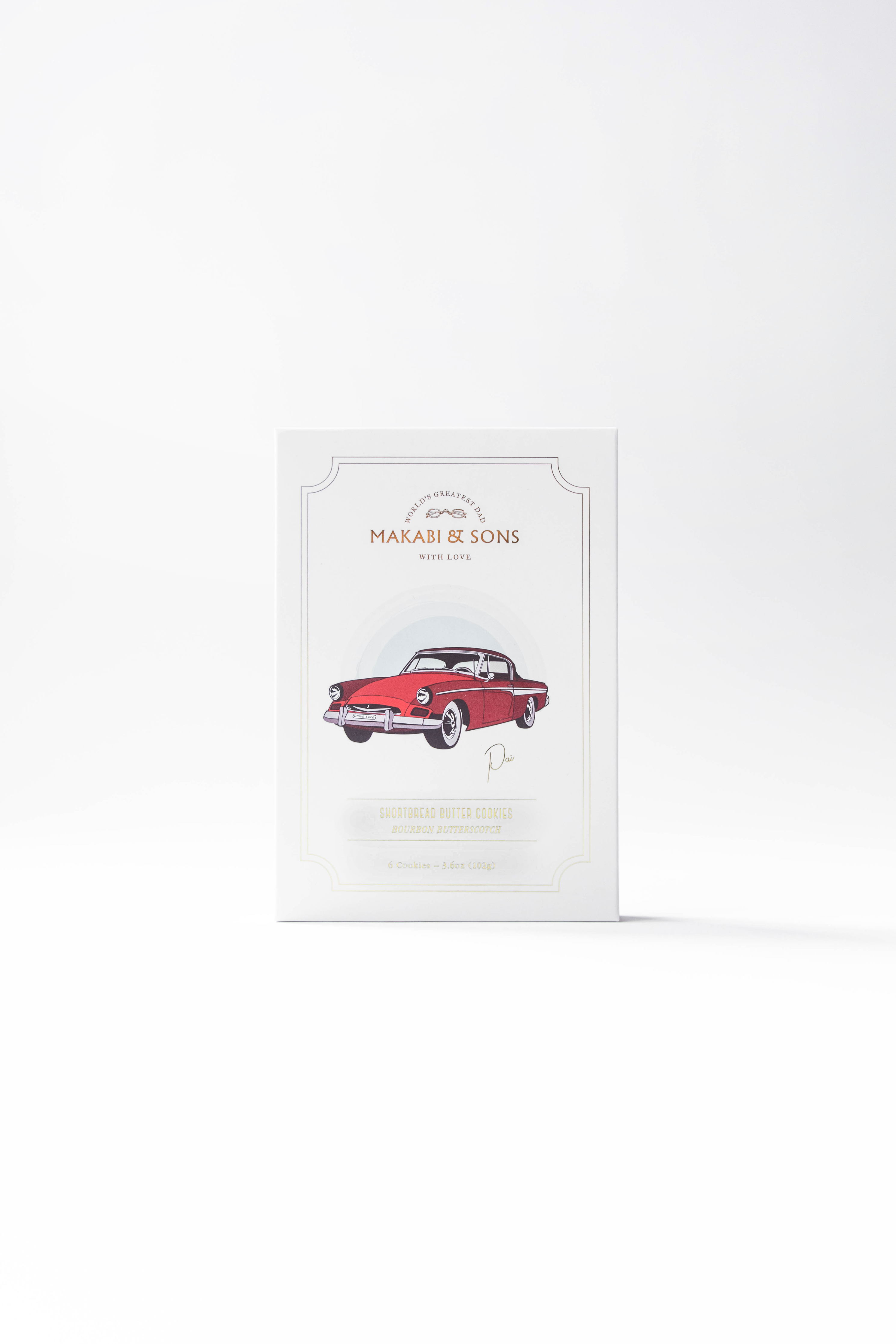 Cookie package with red car illustration with 'Maison de Mons' branding on a white background