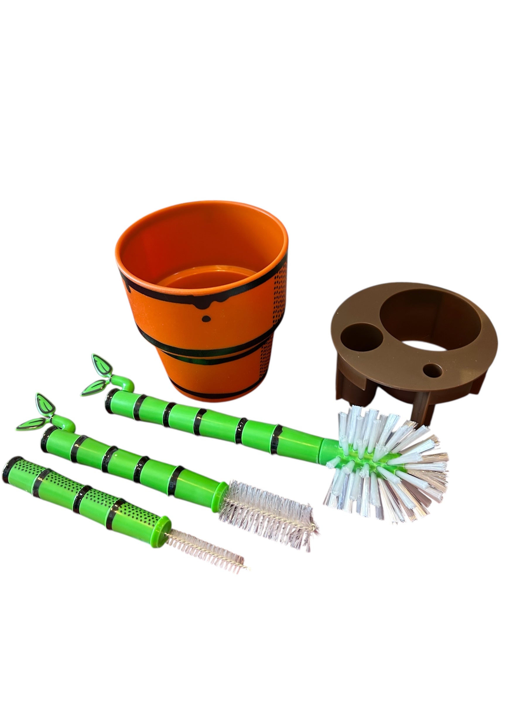 Decorative bamboo plant looking bottle brush set on a white background