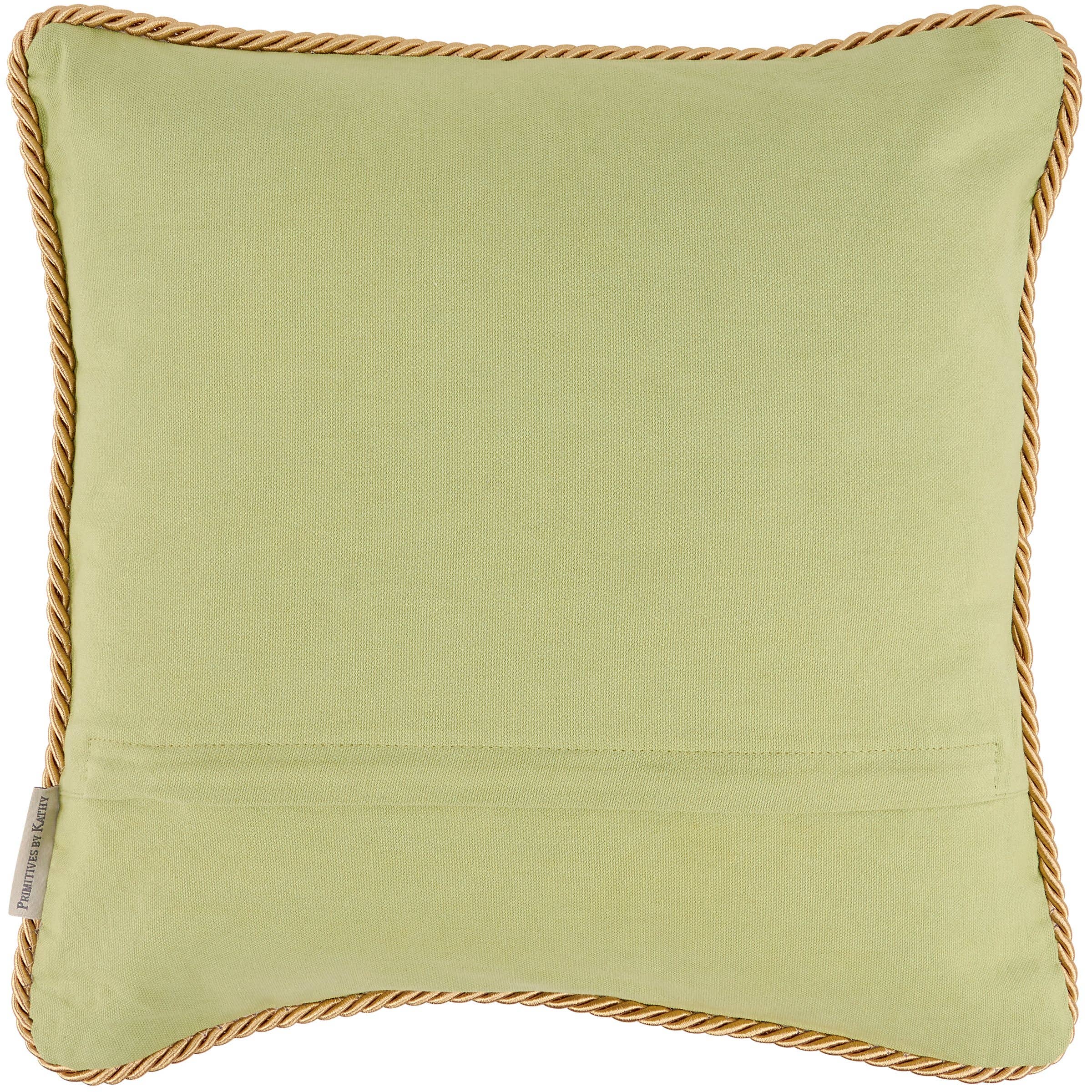 Green pillow with gold trim on a white background