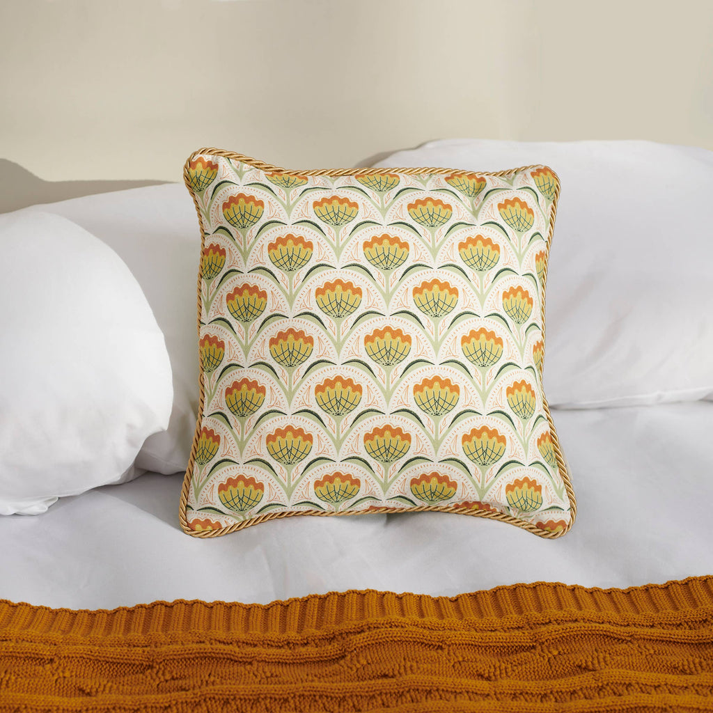 Decorative pillow with floral pattern on a white sofa