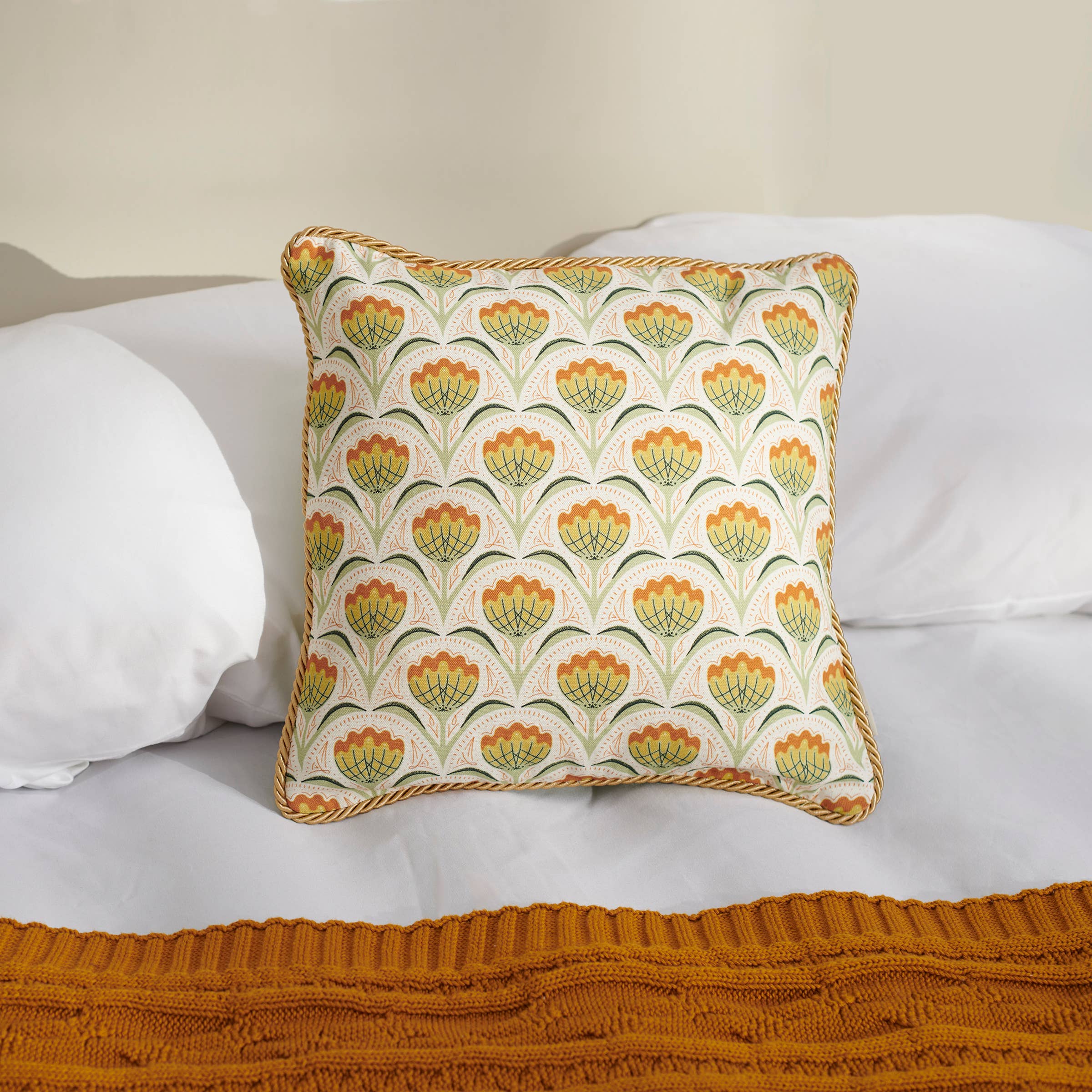 Decorative pillow with floral pattern on a white sofa