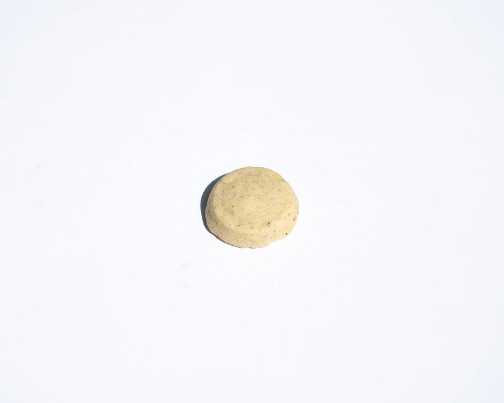 Round shortbread cookie on a white background