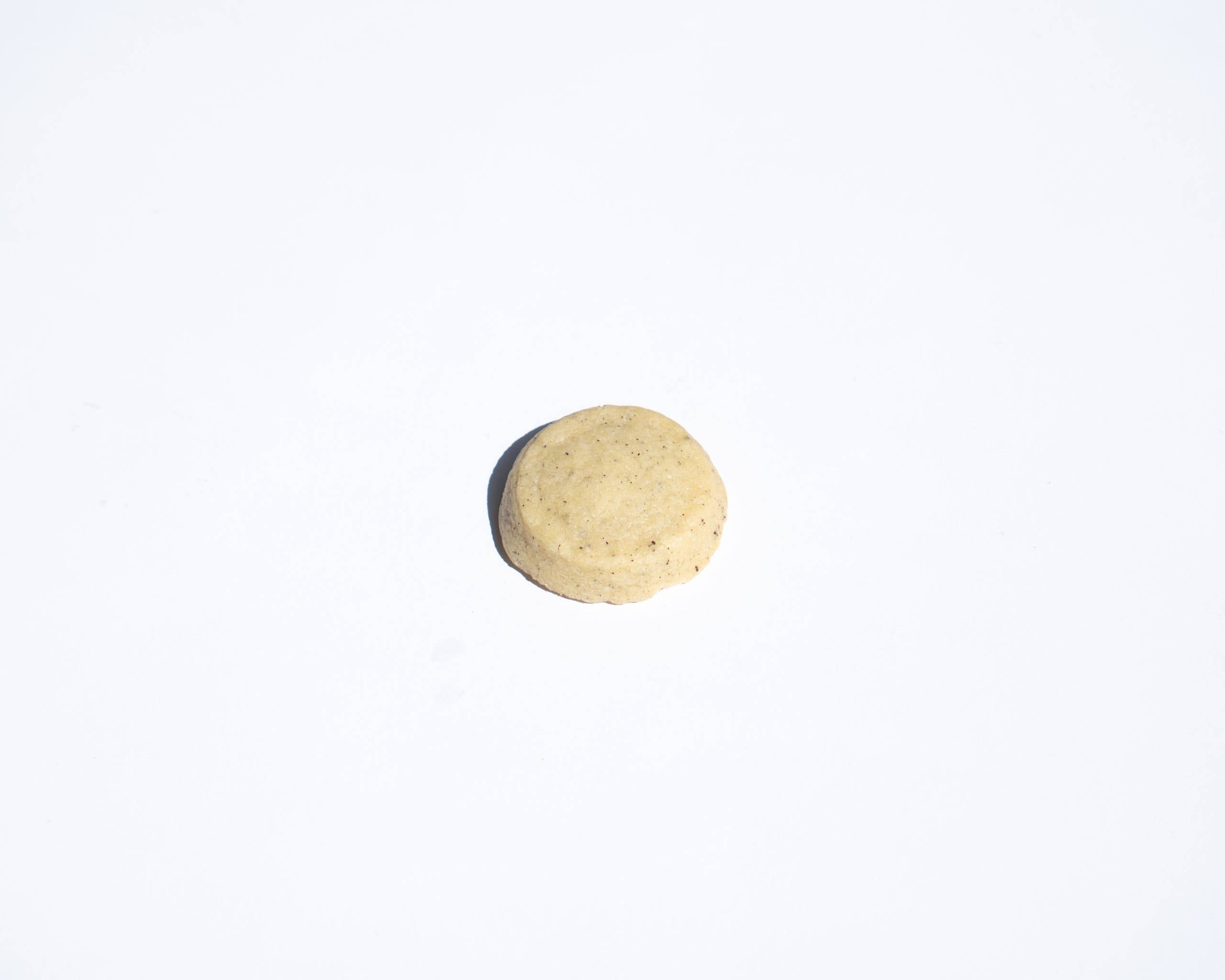 Round shortbread cookie on a white background
