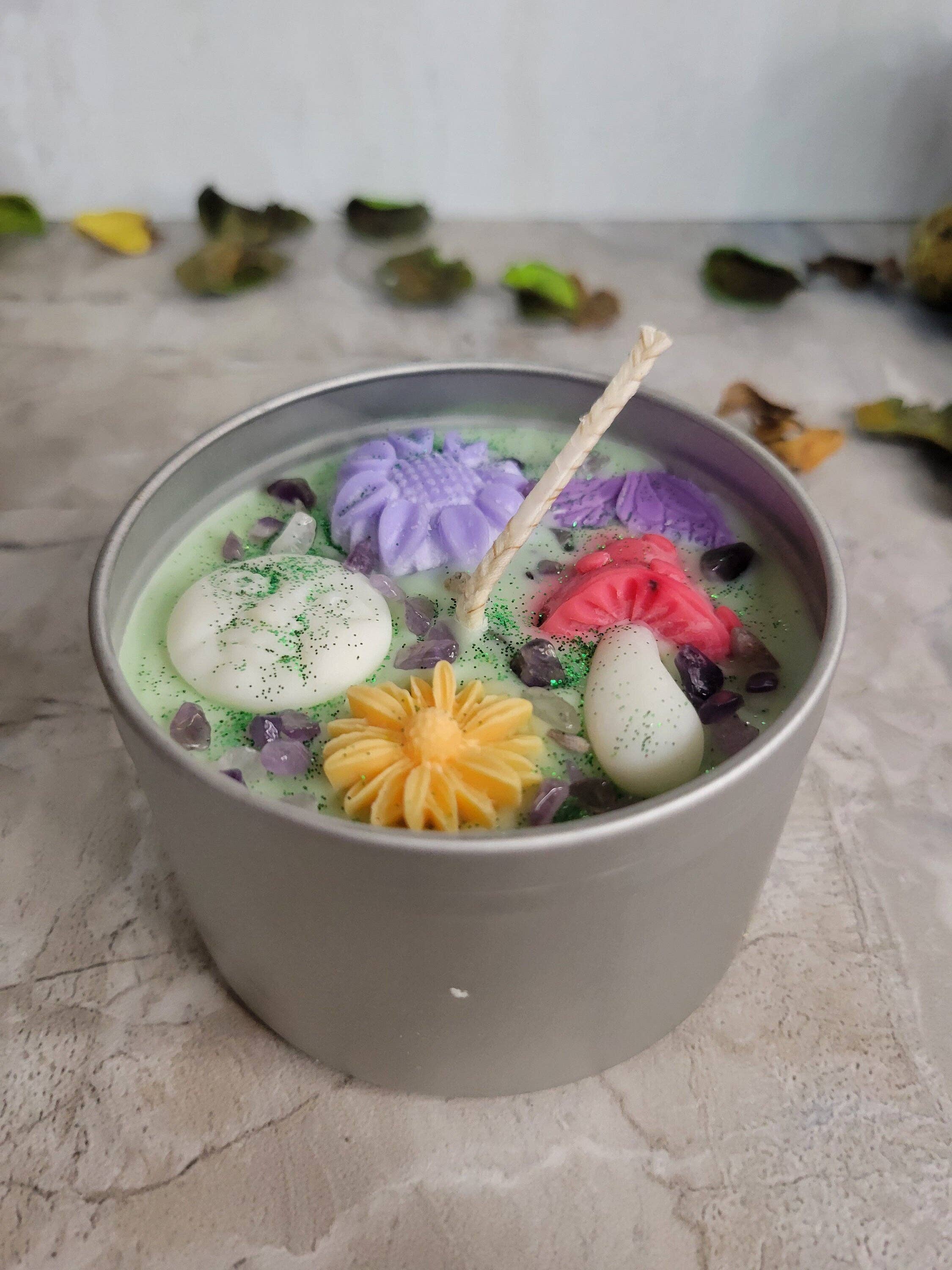 Colorful Soy Candle in a metal container on a marble surface