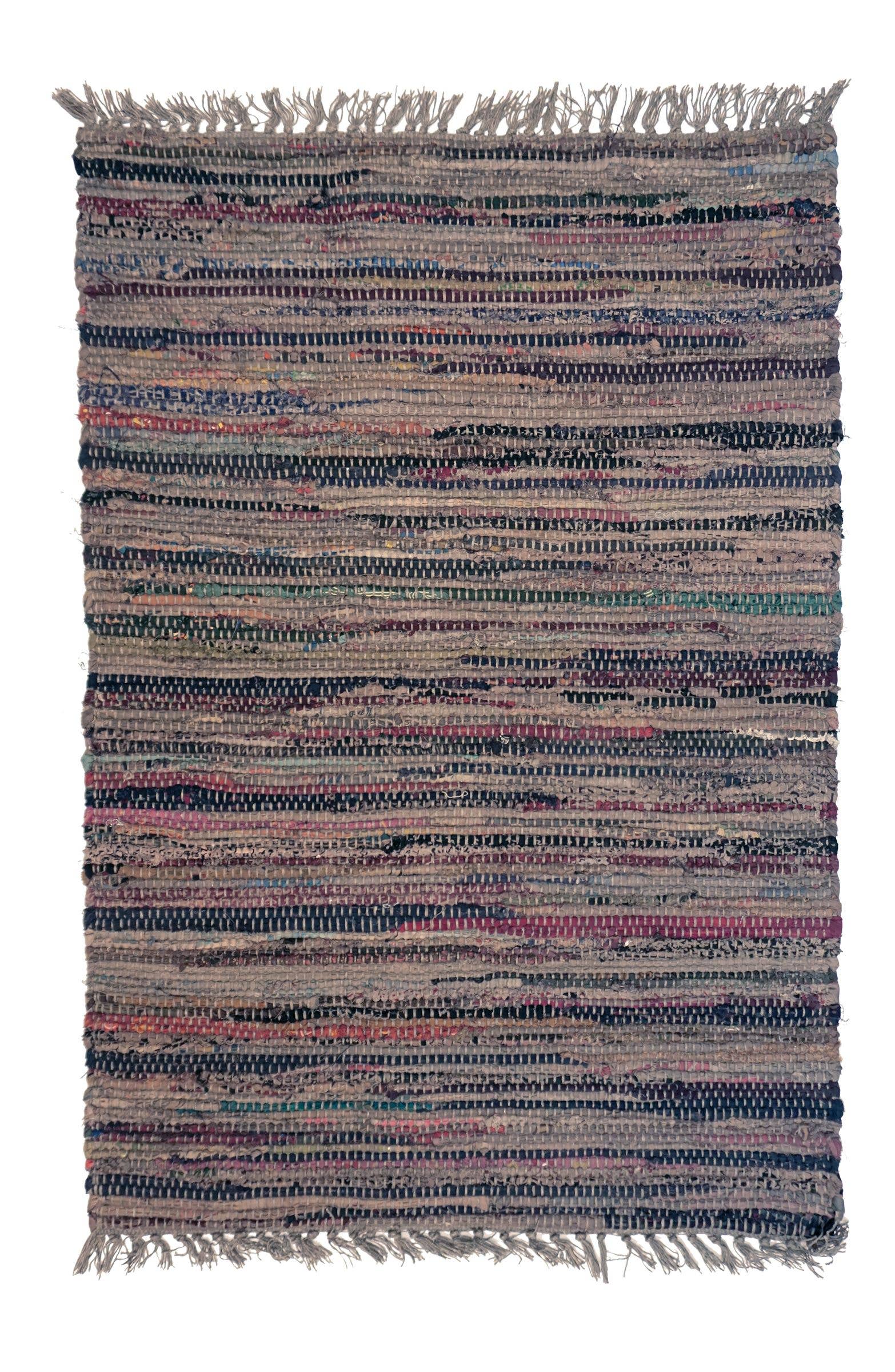 Multicolored woven rug with fringes on a white background