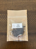 Pouch of Palo Santo on a wooden surface
