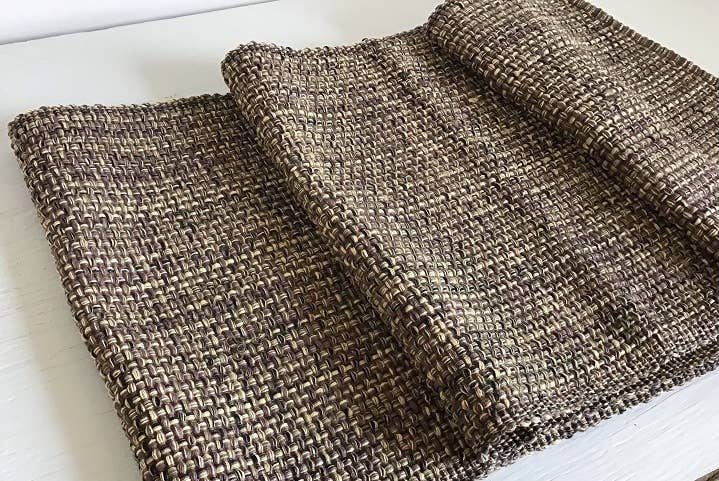 Textured fabric table runner on a white background