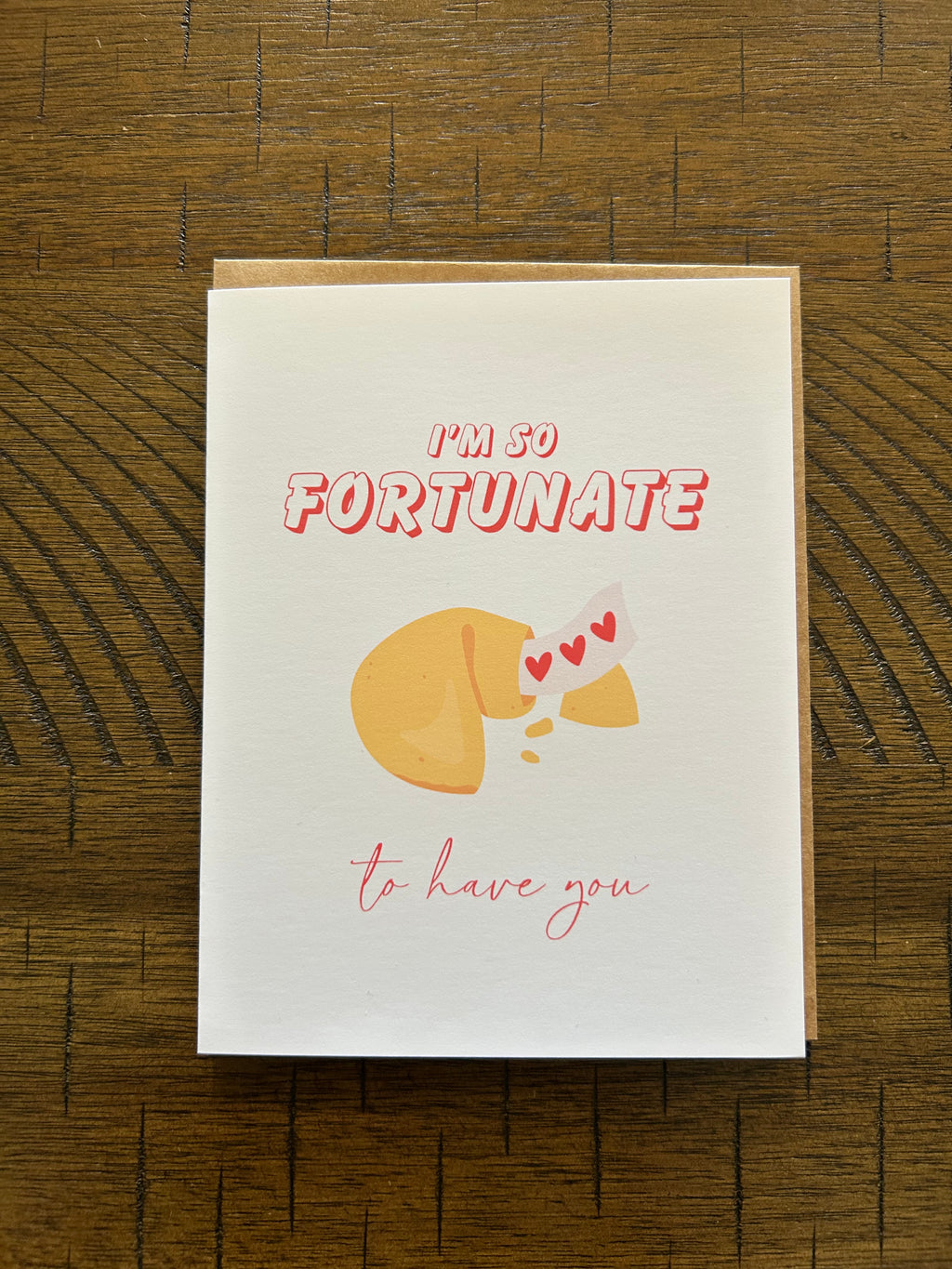 Greeting card with a fortune cookie illustration and text on a white background