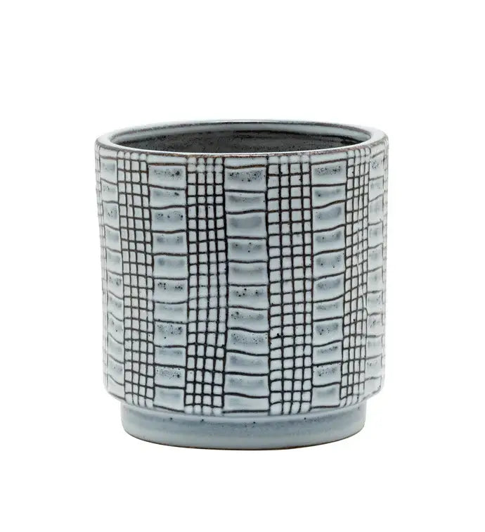 Ceramic planter with grid pattern on a white background