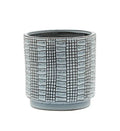 Ceramic planter with grid pattern on a white background