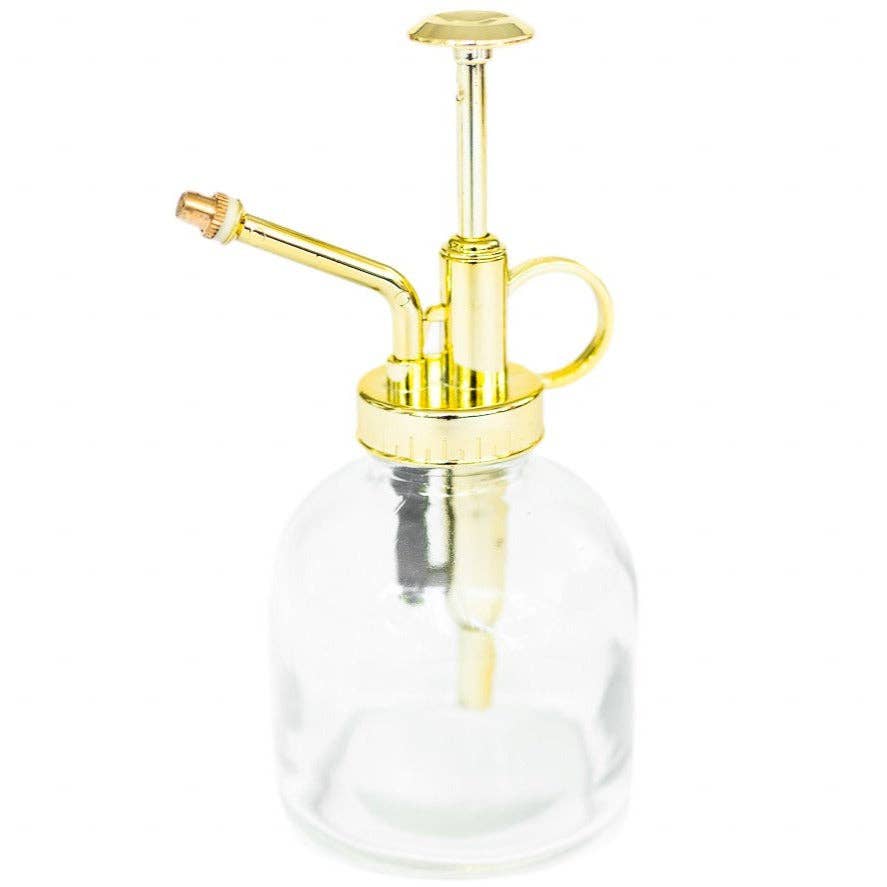 Gold nozzle glass atomizer on a white background