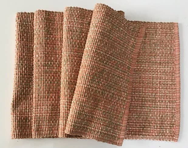 Cotton woven table runner with a textured pattern on a light gray background