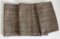 Textured fabric table runner on a white background