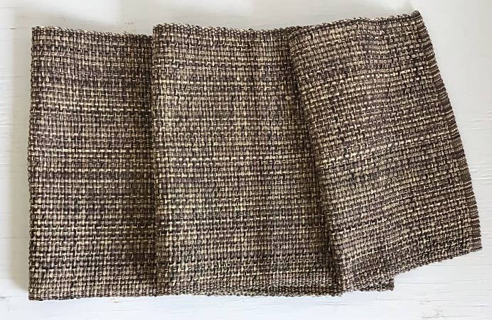 Textured fabric table runner on a white background
