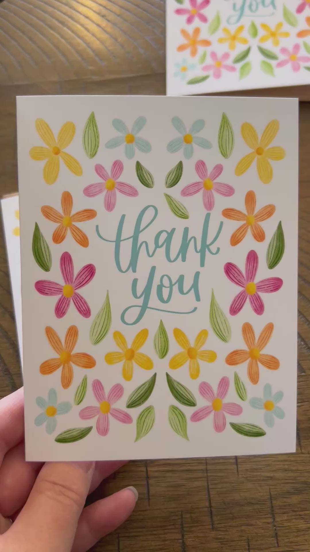 Short Video of White Cardstock with colorful flowers that says Thank You.  Shows blank inside, back, and envelope