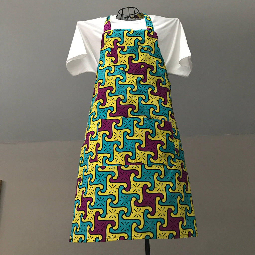 A colorful apron featuring a geometric pattern, displayed on a mannequin.